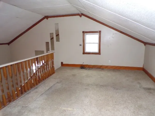 a view of an empty room with stairs