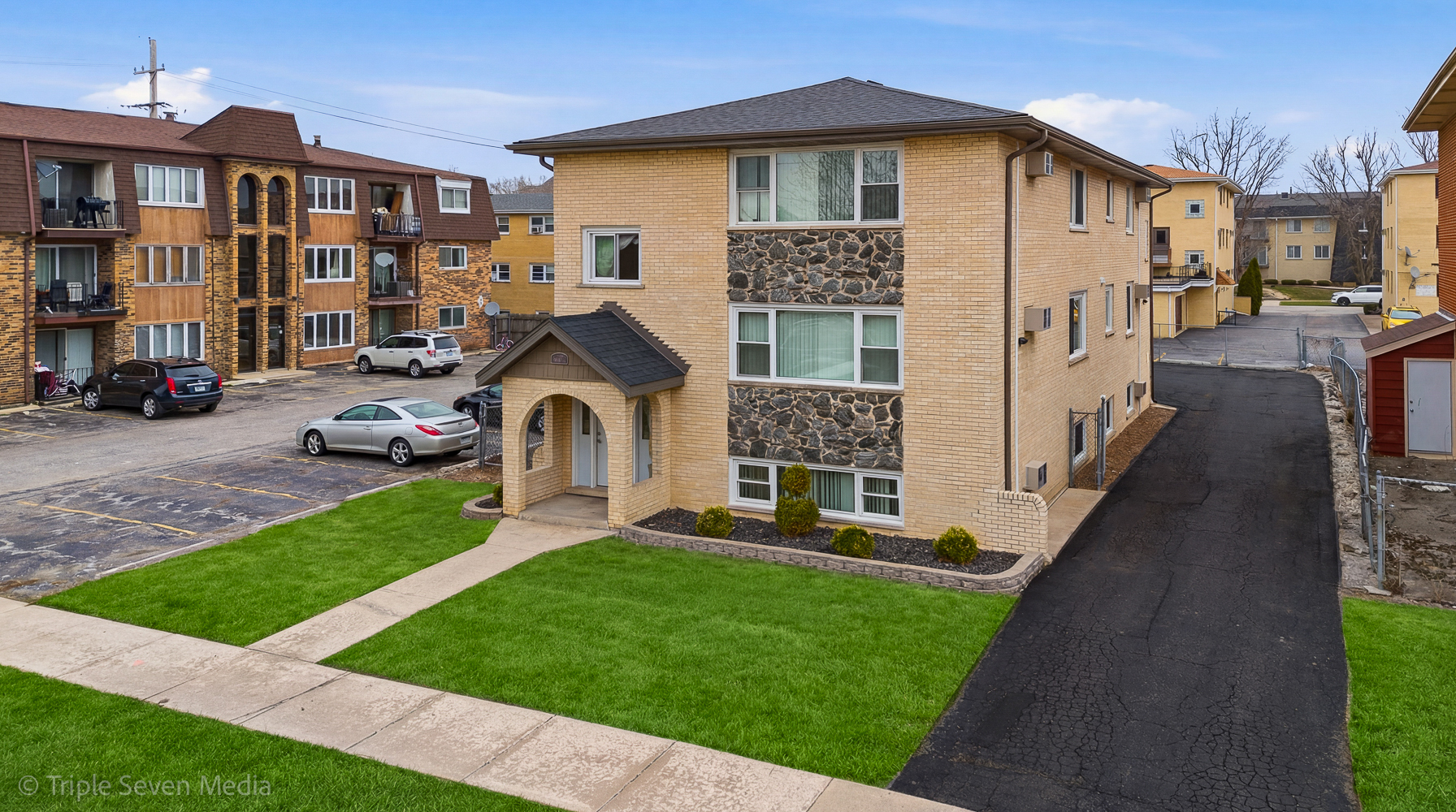 a front view of a house with garden