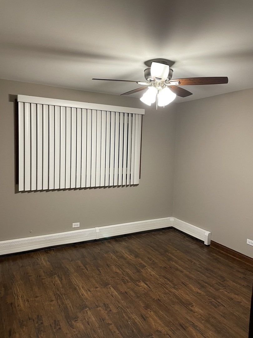 10301 McVicker Avenue Chicago Ridge, IL 60415 - Photo 14 of 21 a view of wooden floor and chandelier fan in a room