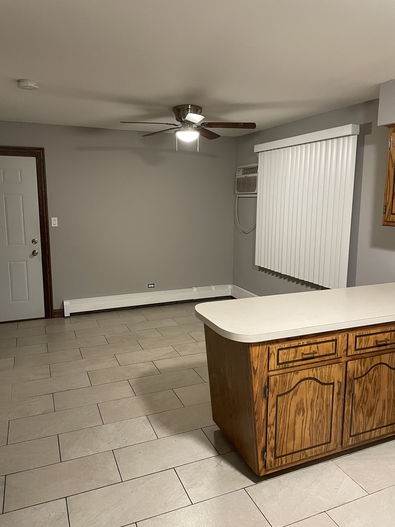 10301 McVicker Avenue Chicago Ridge, IL 60415 - Photo 19 of 21 a kitchen with a cabinets and chandelier