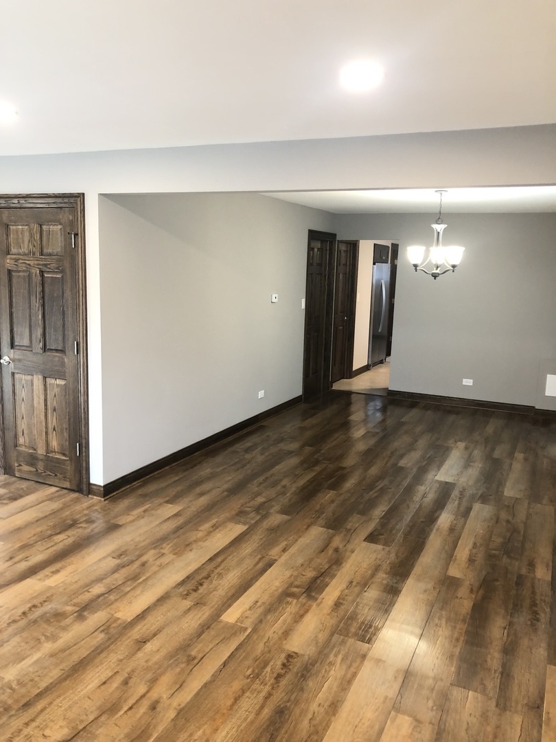 10301 McVicker Avenue Chicago Ridge, IL 60415 - Photo 6 of 21 a view of an empty room with closet and a window
