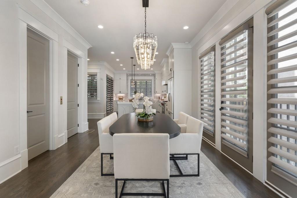3715 Peachtree Road Northeast, Unit 12 Atlanta, GA 30319 - Photo 12 of 62 a dining room with furniture a chandelier and window