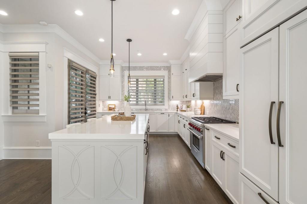 3715 Peachtree Road Northeast, Unit 12 Atlanta, GA 30319 - Photo 18 of 62 a kitchen with white cabinets and stainless steel appliances