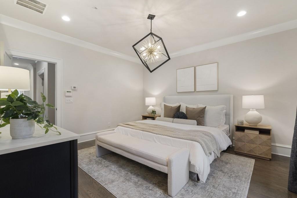 3715 Peachtree Road Northeast, Unit 12 Atlanta, GA 30319 - Photo 28 of 62 a bedroom with a bed and a table with mirror
