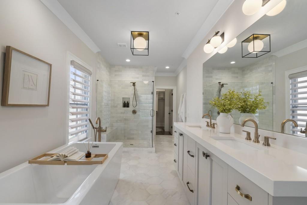 3715 Peachtree Road Northeast, Unit 12 Atlanta, GA 30319 - Photo 30 of 62 a bathroom with a tub sink and mirror