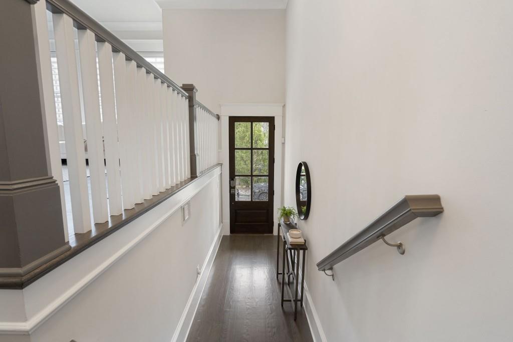 3715 Peachtree Road Northeast, Unit 12 Atlanta, GA 30319 - Photo 4 of 62 a view of a hallway with wooden floor and staircase