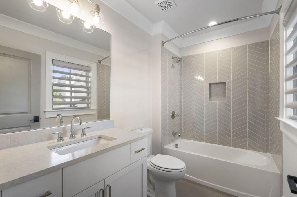 3715 Peachtree Road Northeast, Unit 12 Atlanta, GA 30319 - Photo 44 of 62 a bathroom with a sink a toilet and shower