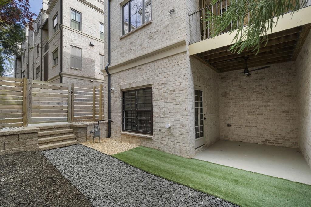 3715 Peachtree Road Northeast, Unit 12 Atlanta, GA 30319 - Photo 55 of 62 a view of a house with a yard