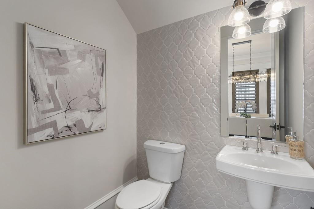 3715 Peachtree Road Northeast, Unit 12 Atlanta, GA 30319 - Photo 8 of 62 a bathroom with a toilet sink and mirror