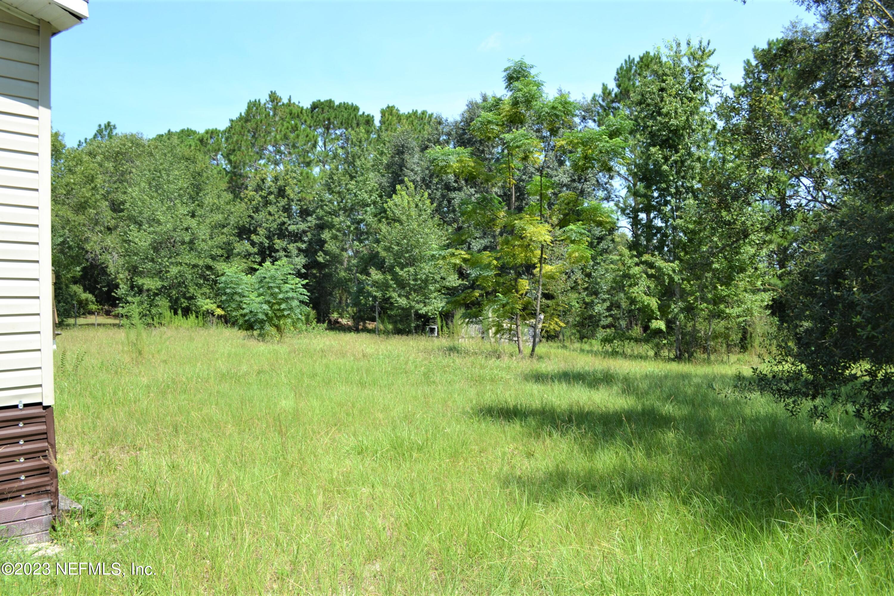 4520 Racoon Run Middleburg, FL 32068 - Photo 16 of 26 a view of a garden