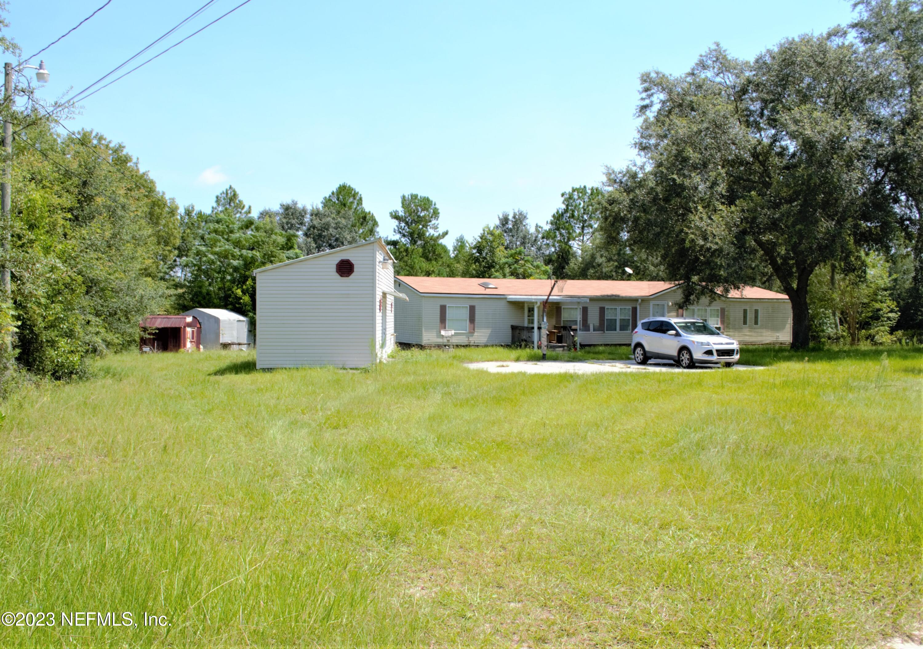 4520 Racoon Run Middleburg, FL 32068 - Photo 26 of 26 a house view with a garden space