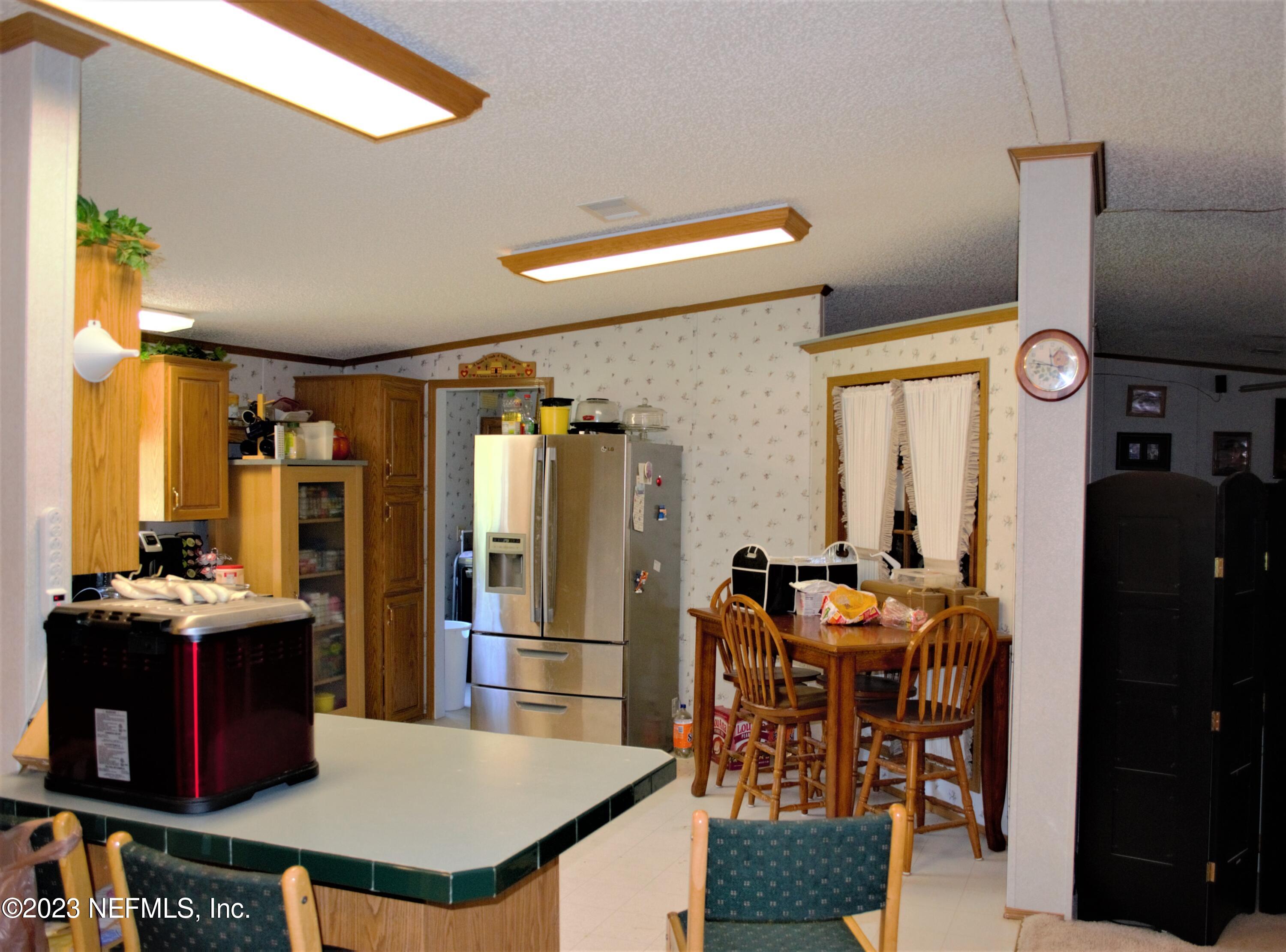 4520 Racoon Run Middleburg, FL 32068 - Photo 8 of 26 a view of a dining room with furniture