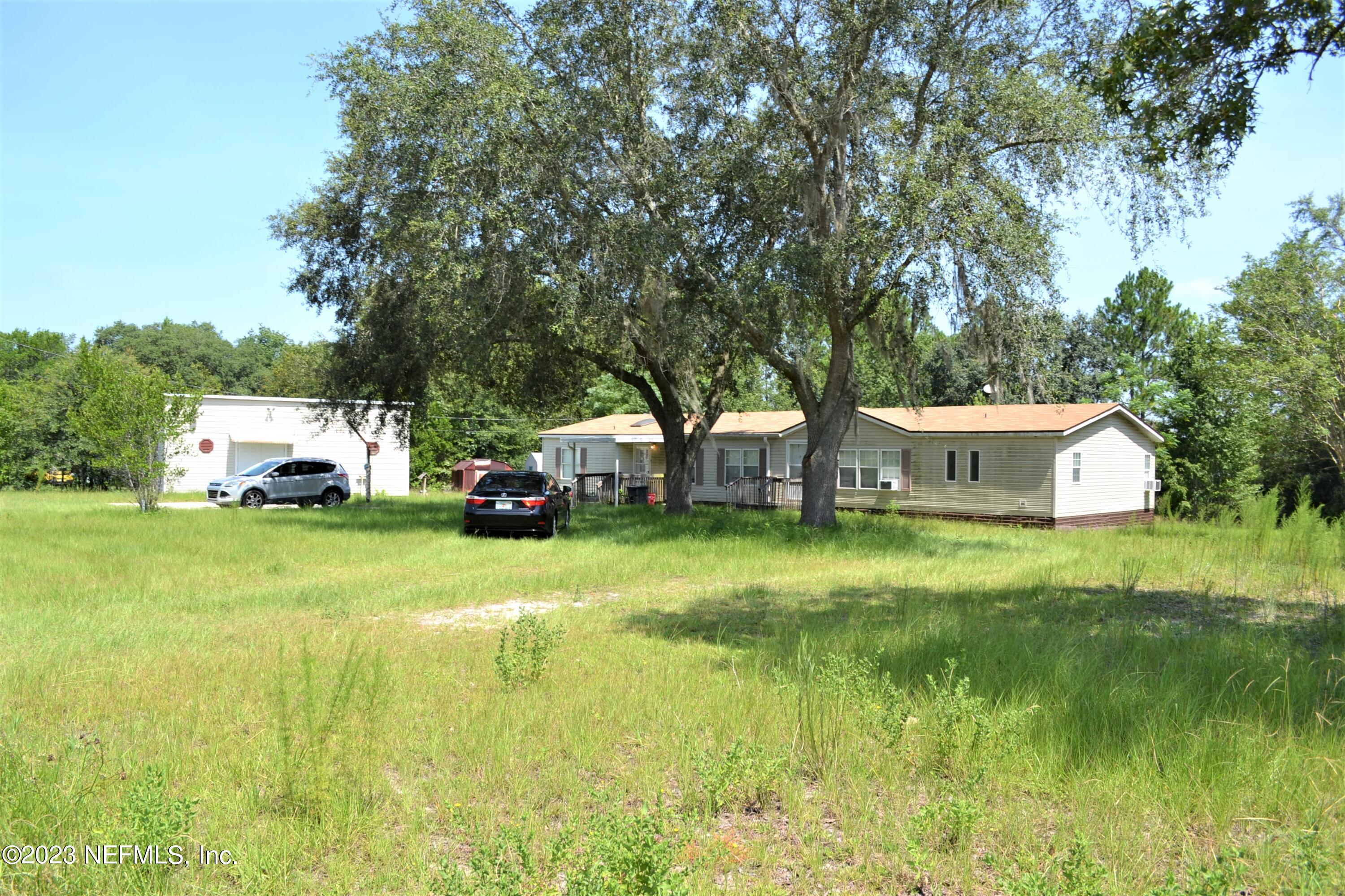 4520 Racoon Run Middleburg, FL 32068 - Photo 9 of 26 a view of a garden with house