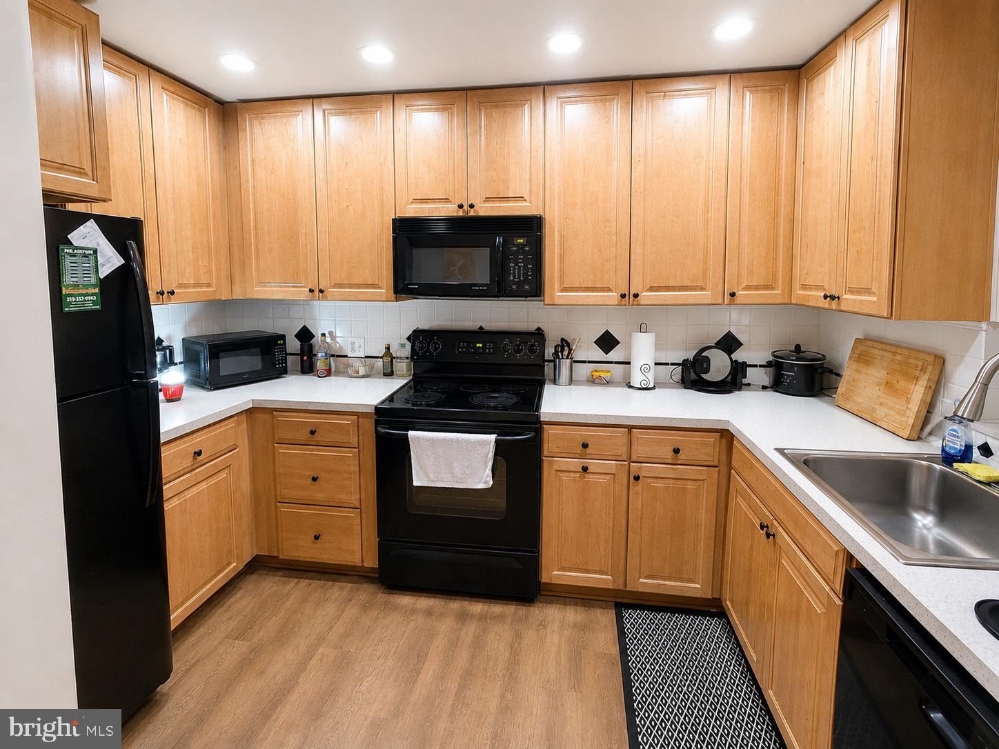 25 South Church Road, Unit 52 Maple Shade, NJ 08052 - Photo 3 of 10 a kitchen with a sink stove top oven and cabinets