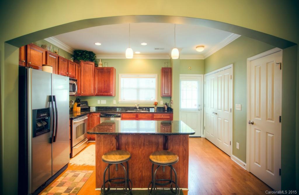 4138 Walker Road, Unit 4138 Charlotte, NC 28211 - Photo 2 of 24 a kitchen with stainless steel appliances granite countertop a refrigerator and a sink