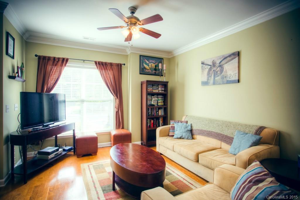 4138 Walker Road, Unit 4138 Charlotte, NC 28211 - Photo 13 of 24 a living room with furniture a flat screen tv and a window