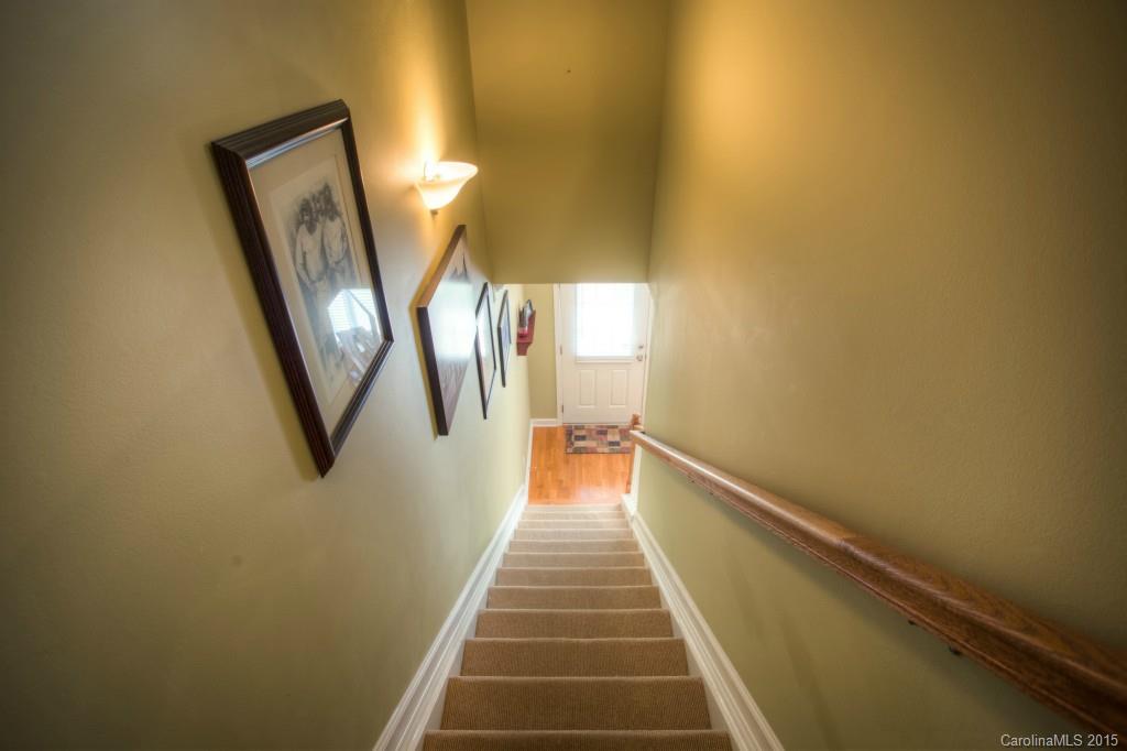 4138 Walker Road, Unit 4138 Charlotte, NC 28211 - Photo 15 of 24 a view of a hallway with wooden floor and staircase