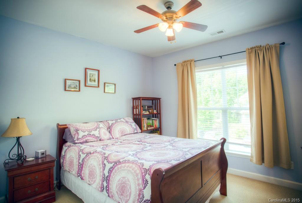 4138 Walker Road, Unit 4138 Charlotte, NC 28211 - Photo 21 of 24 a bedroom with a large bed and a window