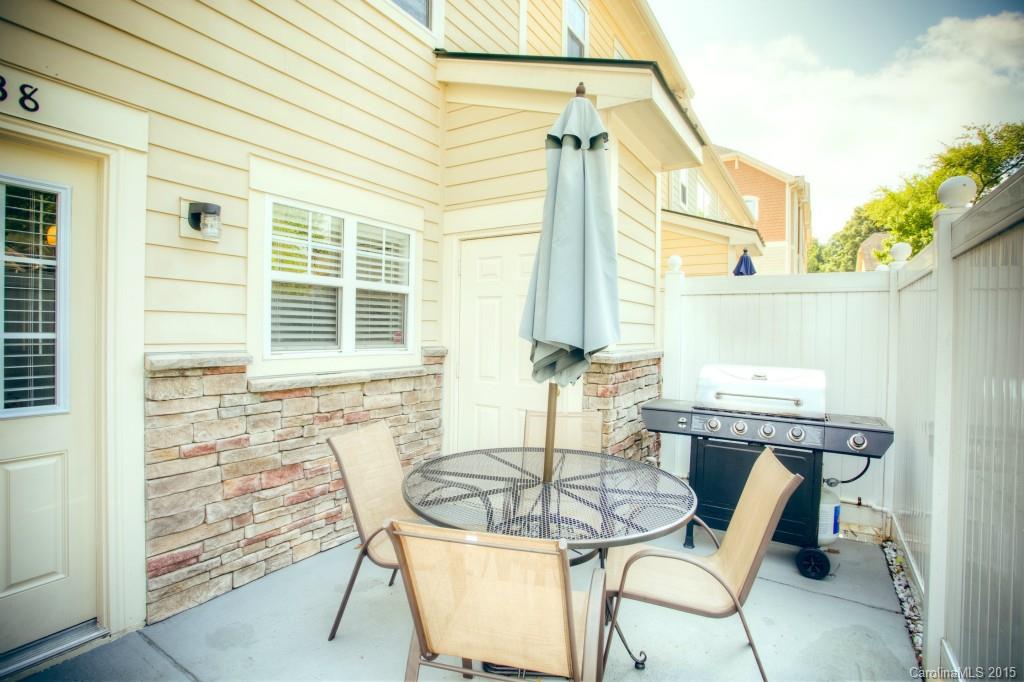 4138 Walker Road, Unit 4138 Charlotte, NC 28211 - Photo 24 of 24 a table and chairs in a patio