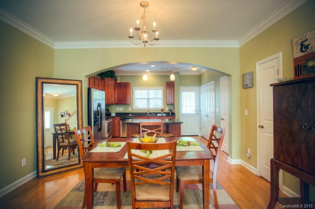 4138 Walker Road, Unit 4138 Charlotte, NC 28211 - Photo 8 of 24 a view of a dining room with furniture and wooden floor