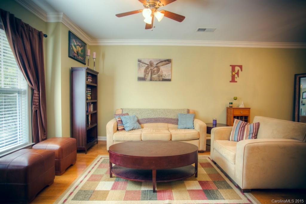 4138 Walker Road, Unit 4138 Charlotte, NC 28211 - Photo 10 of 24 a living room with furniture a ceiling fan and a window