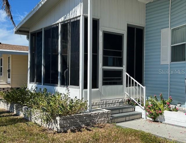 459 Sharks Point North Port, FL 34287 - Photo 1 of 4 a view of a house with a large window and flower plants