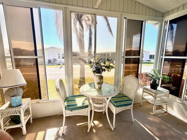 459 Sharks Point North Port, FL 34287 - Photo 2 of 4 a dining room with furniture a chandelier and wooden floor