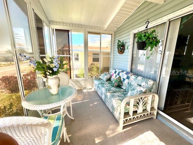 459 Sharks Point North Port, FL 34287 - Photo 3 of 4 a dining room with furniture and a floor to ceiling window