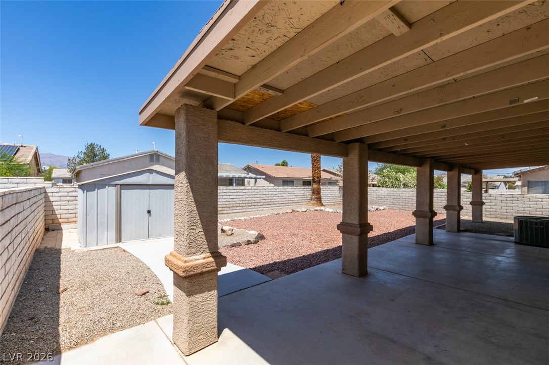 2028 Rustler Ridge Avenue North Las Vegas, NV 89031 - Photo 35 of 40 A spacious covered patio offers ample room for outdoor relaxation and entertaining.