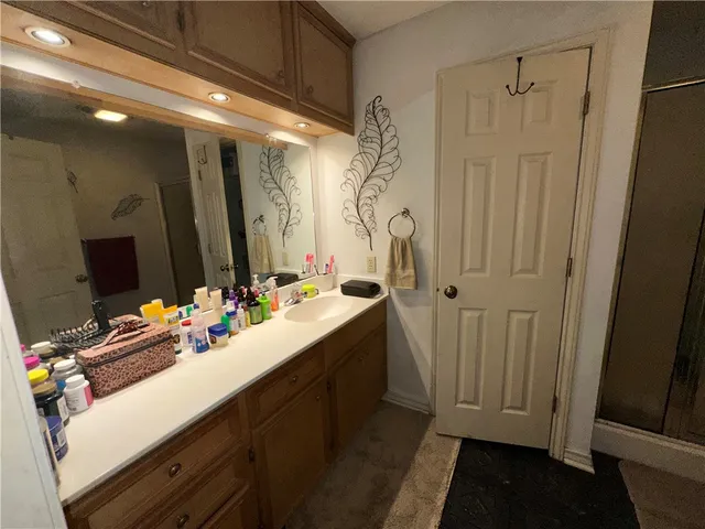 a bathroom with a double vanity sink and mirror
