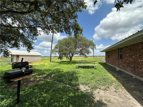 a backyard of a house with lots of green space