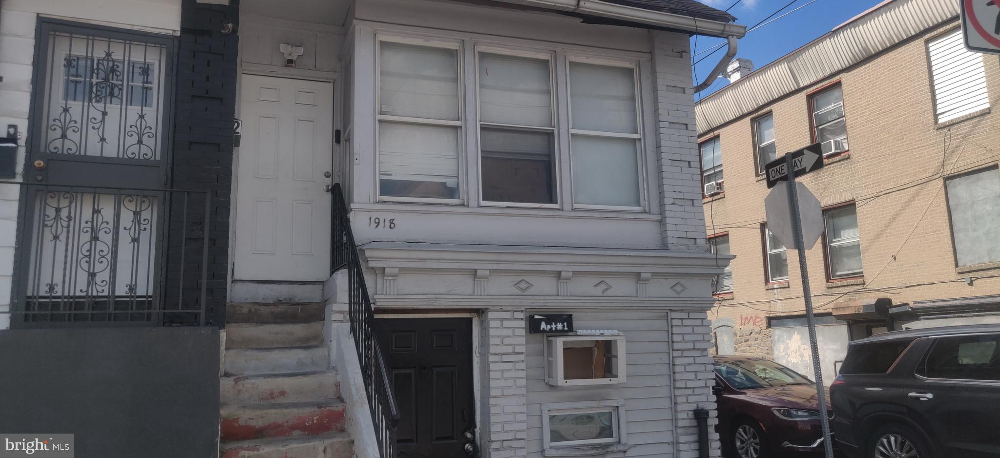 1918 South 65th Street Philadelphia, PA 19142 - Photo 4 of 5 a front view of a building with glass windows
