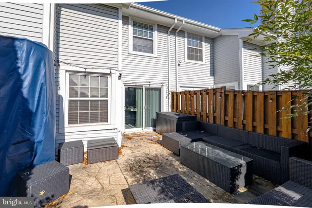 a view of a house with wooden floor in a backyard