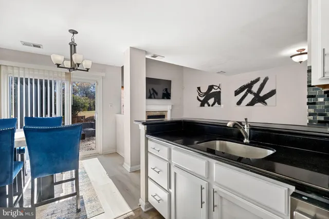 a kitchen with a sink and cabinets