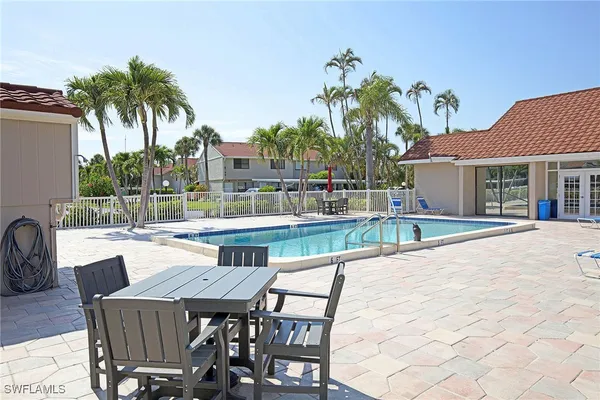 a view of a patio with swimming pool