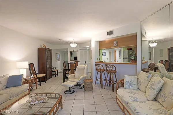 a living room with furniture and a table