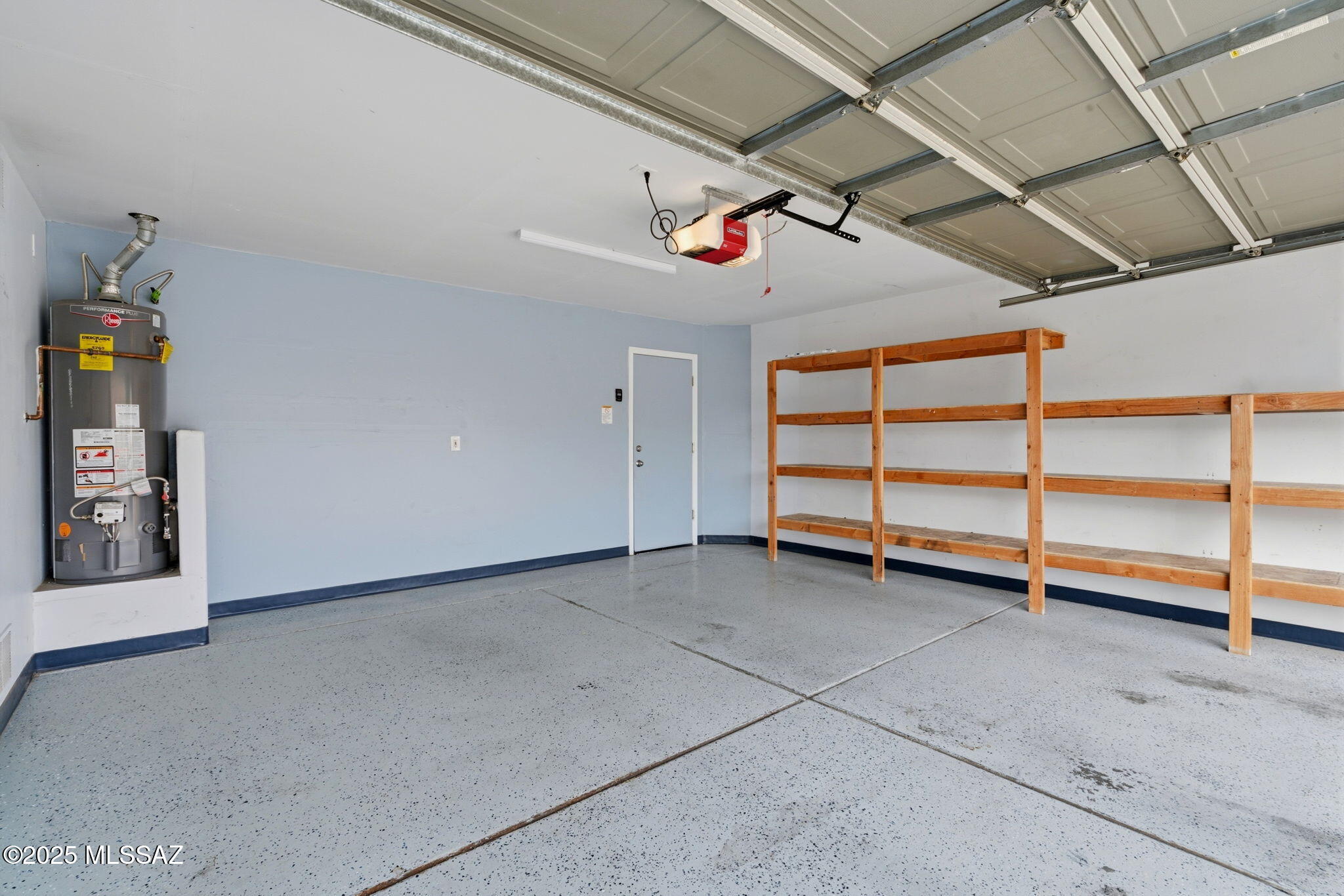 8244 South Lost Mountain Road Tucson, AZ 85747 - Photo 40 of 41 a view of an empty room with a garage