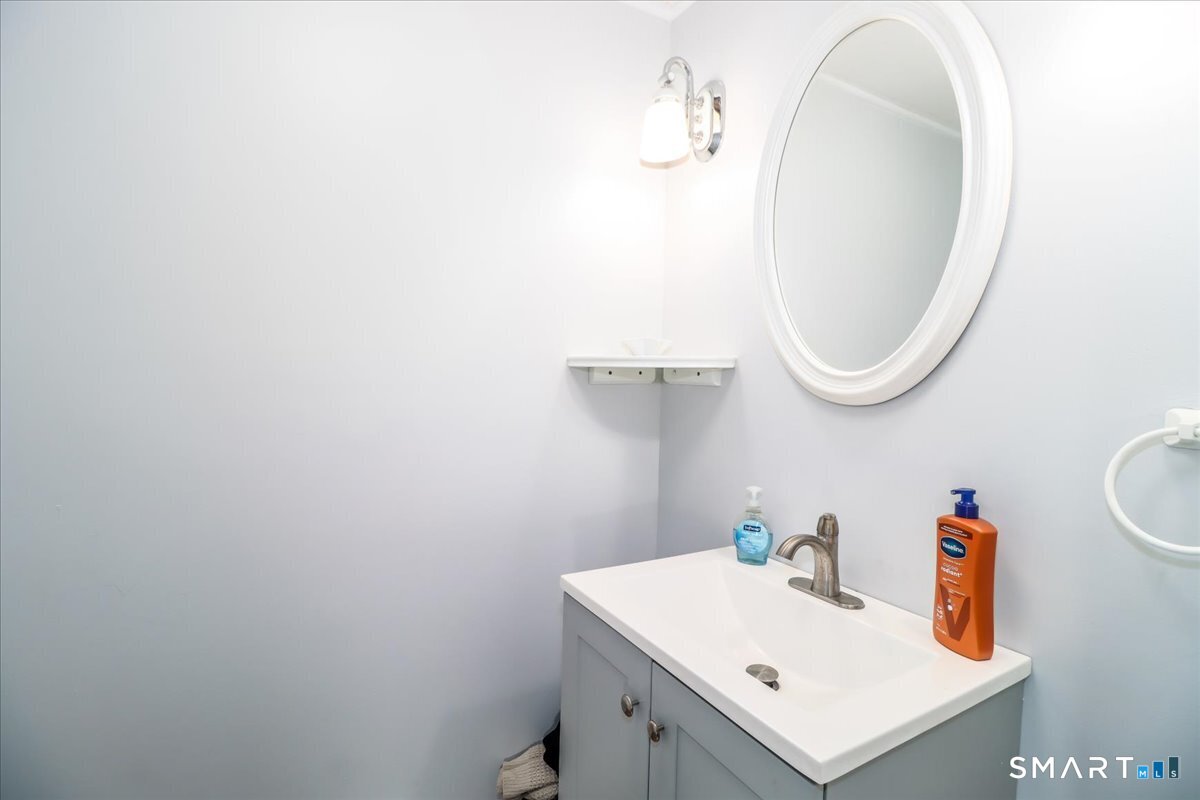 61 Pumpkin Hill Road New Milford, CT 06776 - Photo 17 of 40 a bathroom with a sink and a mirror