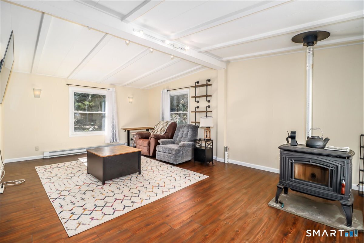 61 Pumpkin Hill Road New Milford, CT 06776 - Photo 18 of 40 a living room with furniture a rug and a window