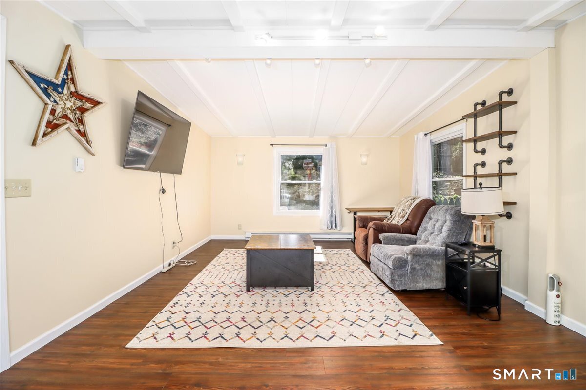 61 Pumpkin Hill Road New Milford, CT 06776 - Photo 19 of 40 a living room with furniture rug and window