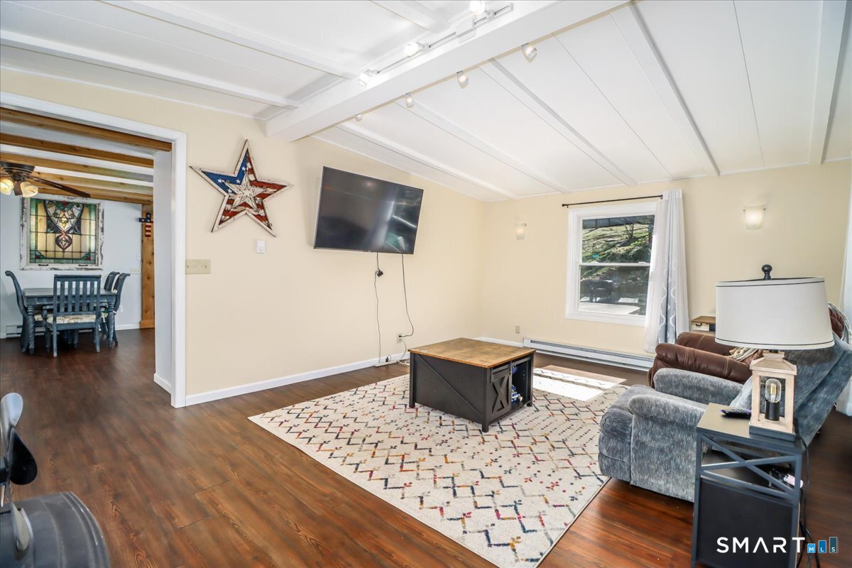 61 Pumpkin Hill Road New Milford, CT 06776 - Photo 20 of 40 a living room with furniture and a window