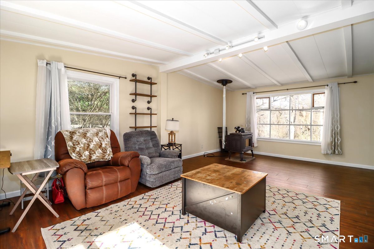 61 Pumpkin Hill Road New Milford, CT 06776 - Photo 21 of 40 a living room with furniture and a large window