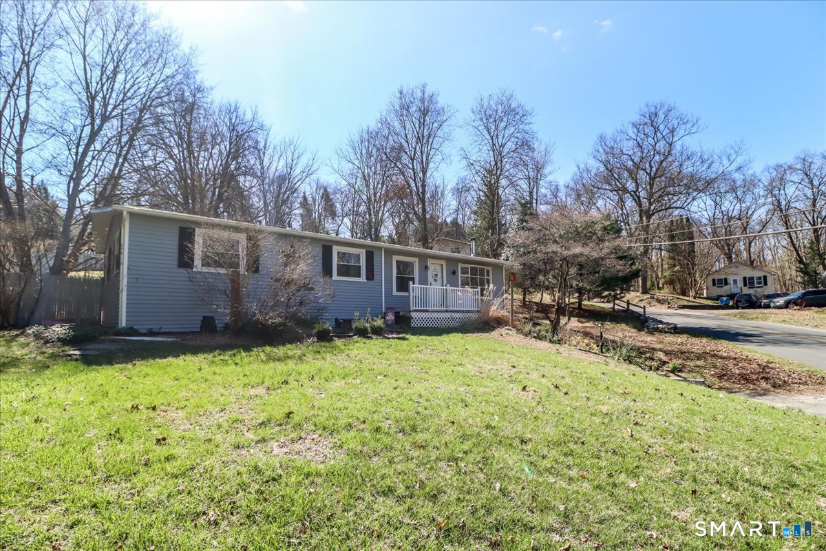 61 Pumpkin Hill Road New Milford, CT 06776 - Photo 28 of 40 a view of backyard with table and chairs and wooden fence