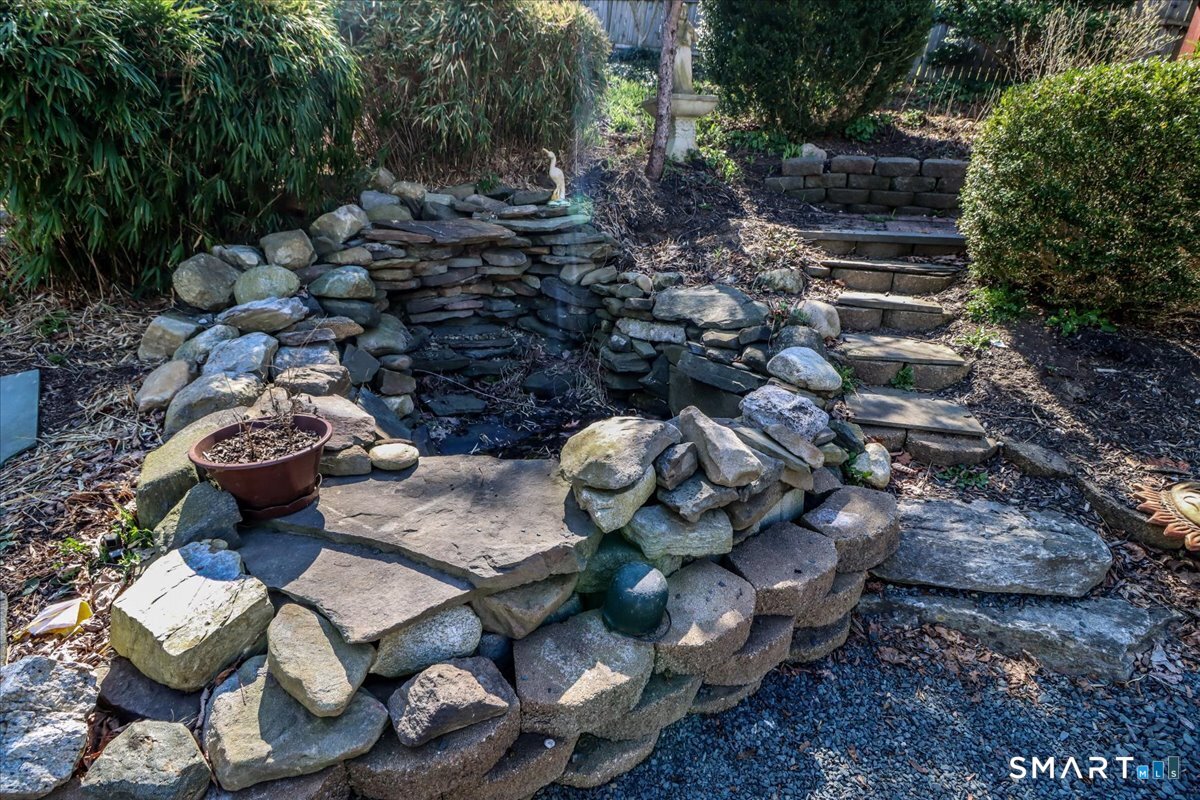 61 Pumpkin Hill Road New Milford, CT 06776 - Photo 37 of 40 a backyard of a house with lots of green space