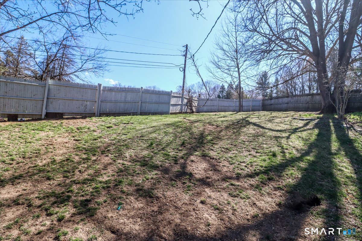 61 Pumpkin Hill Road New Milford, CT 06776 - Photo 39 of 40 a view of a yard with wooden fence