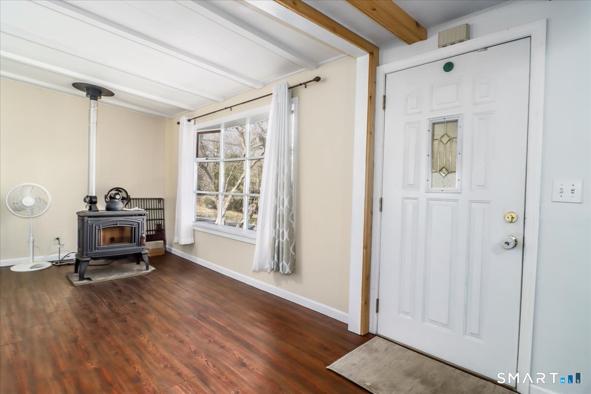 61 Pumpkin Hill Road New Milford, CT 06776 - Photo 4 of 40 a living room with furniture and a window