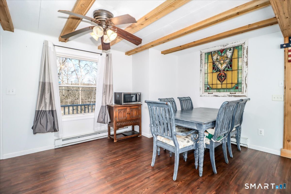 61 Pumpkin Hill Road New Milford, CT 06776 - Photo 8 of 40 a view of a dining room with furniture window and wooden floor