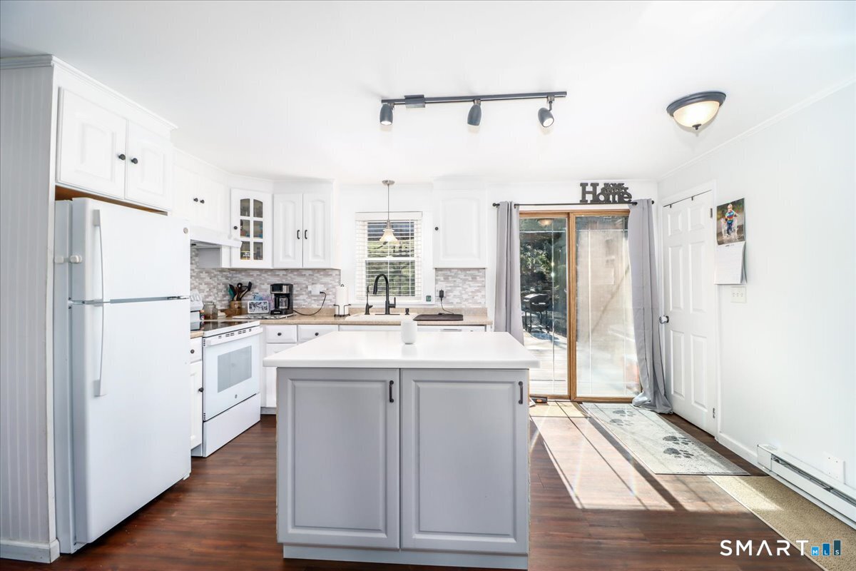 61 Pumpkin Hill Road New Milford, CT 06776 - Photo 10 of 40 a kitchen with white cabinets and refrigerator