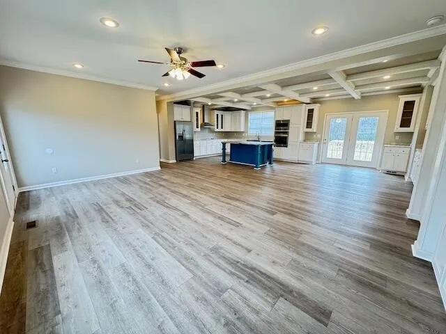a view of livingroom with hardwood floor and ceiling fan