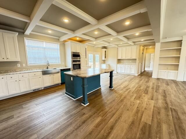 122 Underwood Road, Unit 3 Sweetwater, TN 37874 - Photo 21 of 52 a large white kitchen with wooden floors and white stainless steel appliances